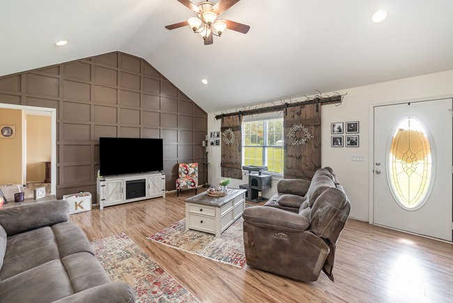 626 West Harper Road Portland, TN 37148 - Photo 3 of 26 a living room with furniture a large window and a flat screen tv