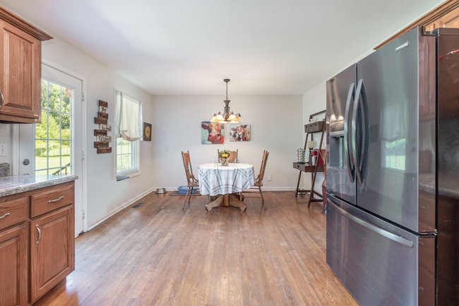 626 West Harper Road Portland, TN 37148 - Photo 4 of 26 a dining room with furniture window wooden floor and a window