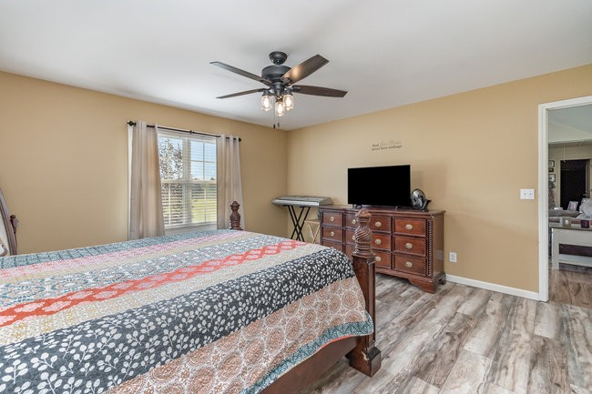 626 West Harper Road Portland, TN 37148 - Photo 7 of 26 a bedroom with a bed and a flat screen tv