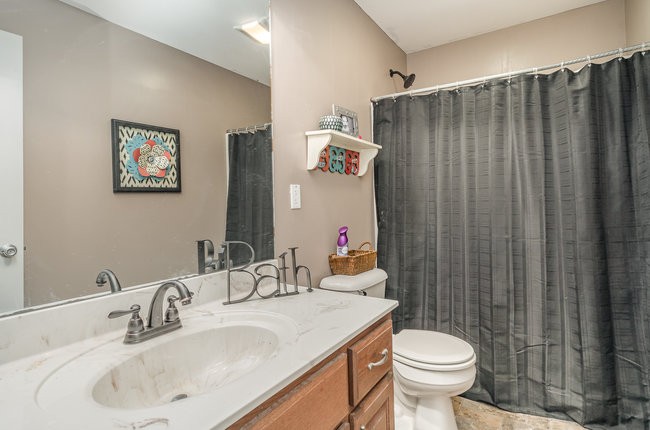 626 West Harper Road Portland, TN 37148 - Photo 9 of 26 a bathroom with a sink a toilet and a mirror