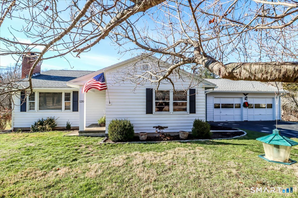 120 Warsaw Street Deep River, CT 06417 - Photo 1 of 39 a front view of a house with a yard and potted plants