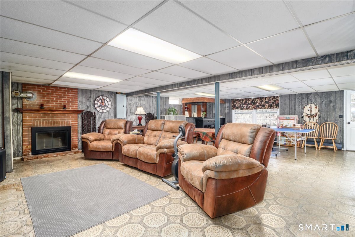 120 Warsaw Street Deep River, CT 06417 - Photo 22 of 39 a living room with furniture and a fireplace