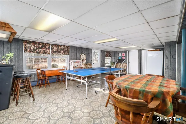 a kitchen with a sink and a stove next to a window