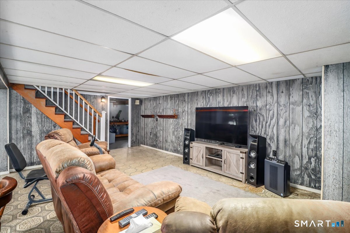 120 Warsaw Street Deep River, CT 06417 - Photo 26 of 39 a living room with furniture and a flat screen tv