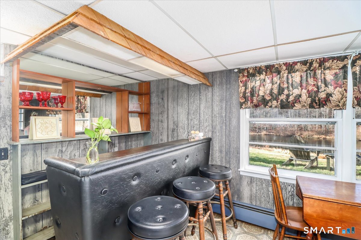 120 Warsaw Street Deep River, CT 06417 - Photo 27 of 39 a kitchen with a sink and a stove next to a window