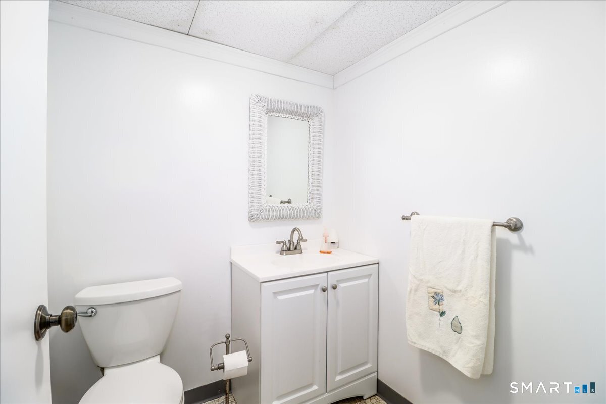 120 Warsaw Street Deep River, CT 06417 - Photo 28 of 39 a bathroom with a toilet sink and mirror