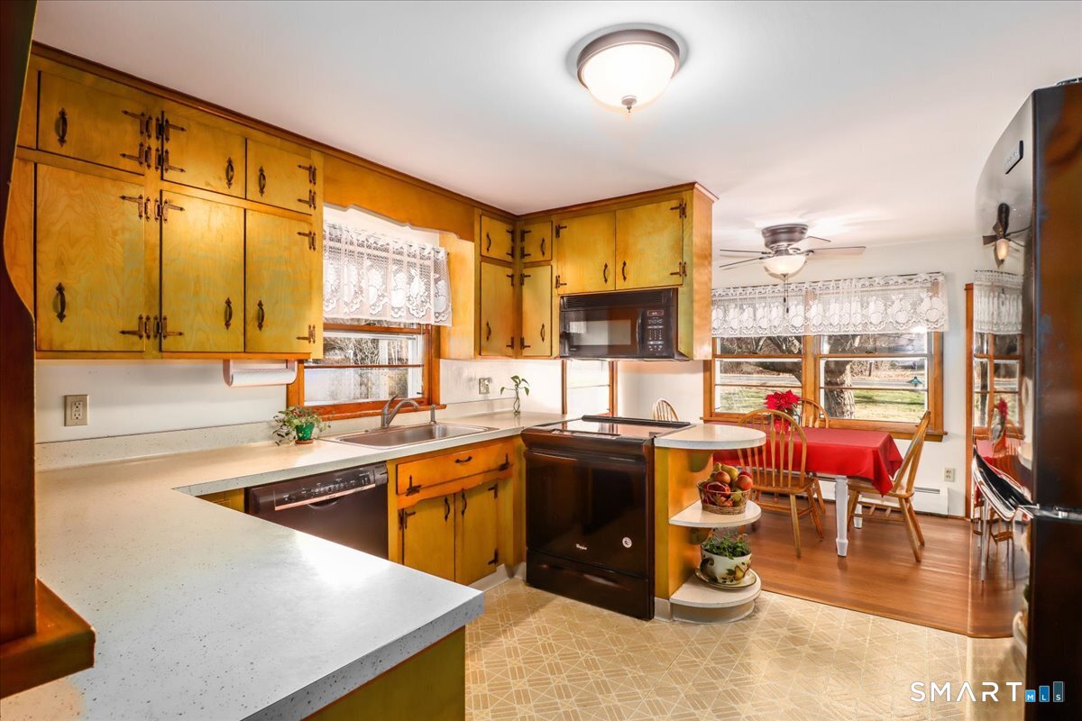 120 Warsaw Street Deep River, CT 06417 - Photo 8 of 39 a kitchen with lots of counter top space and dining table