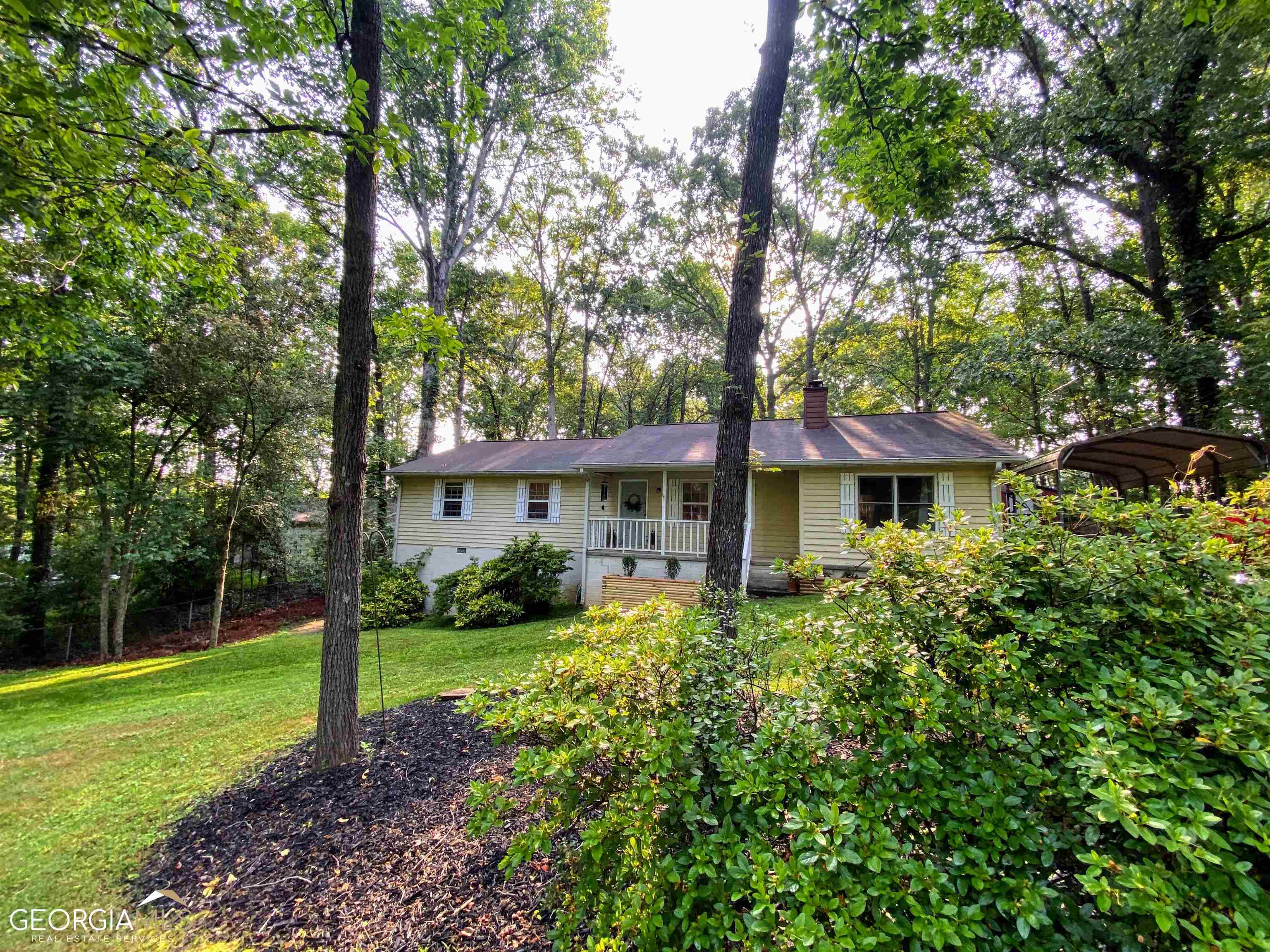 a front view of a house with garden