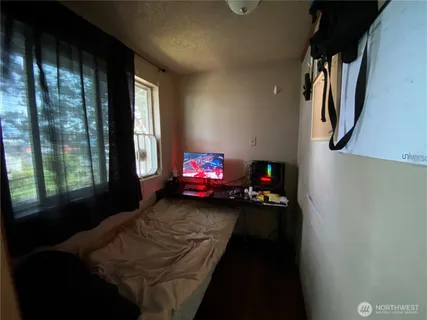 a living room with furniture window and a flat screen tv