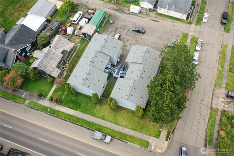 an aerial view of a house with a yard and garden