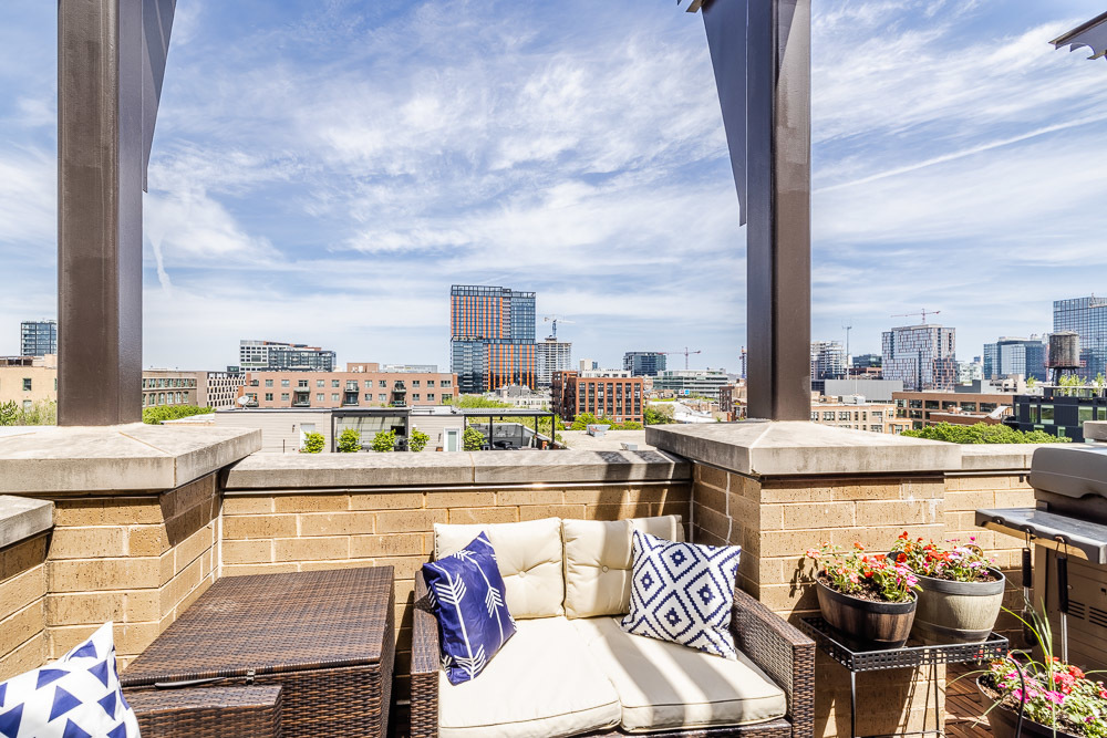1301 West Madison Street, Unit 607 Chicago, IL 60607 - Photo 31 of 39 a view of a balcony with table and chairs