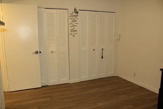 a view of a bathroom with wooden floor