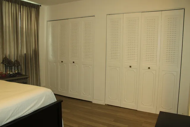 a view of a bathroom with wooden floor