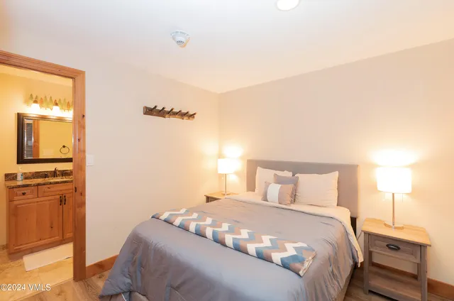 a bedroom with a bed and a tv