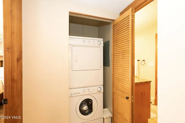 a bathroom with a sink and a washer