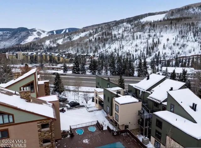 a building outdoor space with patio furniture and potted plants