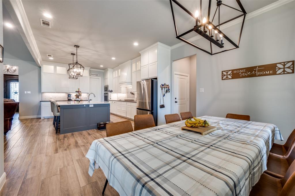 131 San Miguel Drive Decatur, TX 76234 - Photo 14 of 40 a bedroom with a bed and wooden floor