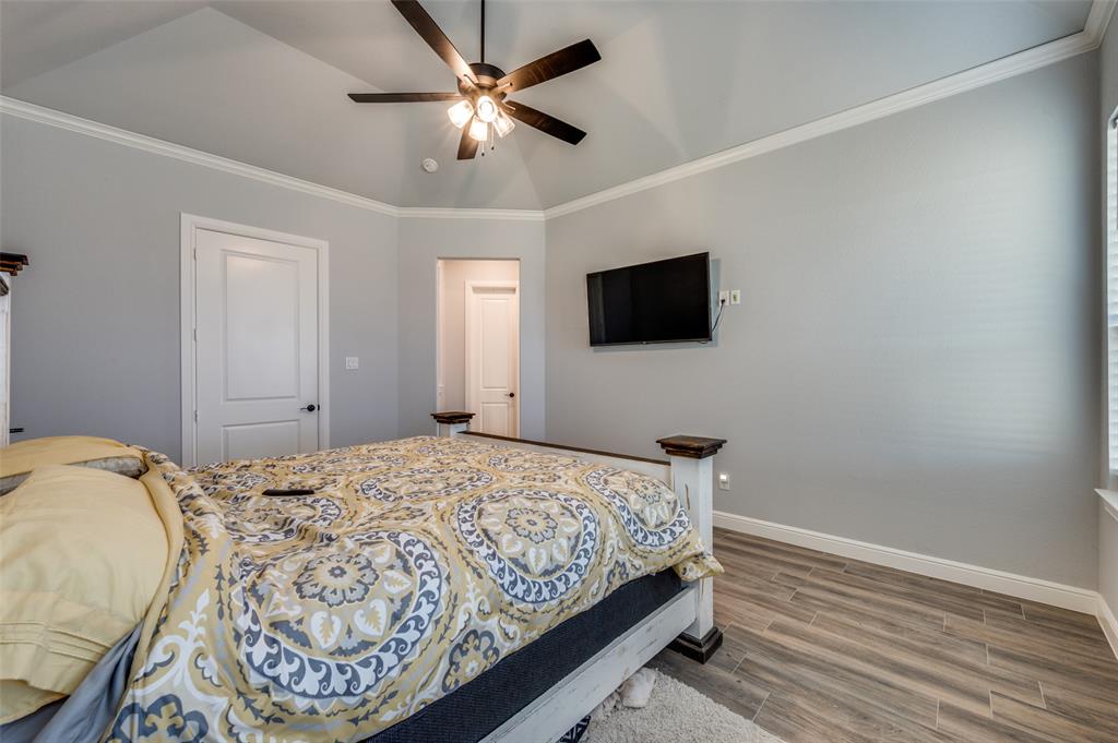 131 San Miguel Drive Decatur, TX 76234 - Photo 22 of 40 a bedroom with a bed and a flat screen tv