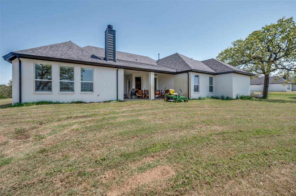 131 San Miguel Drive Decatur, TX 76234 - Photo 33 of 40 a front view of a house with a yard