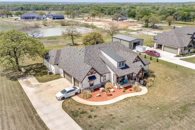 an aerial view of a house with outdoor space