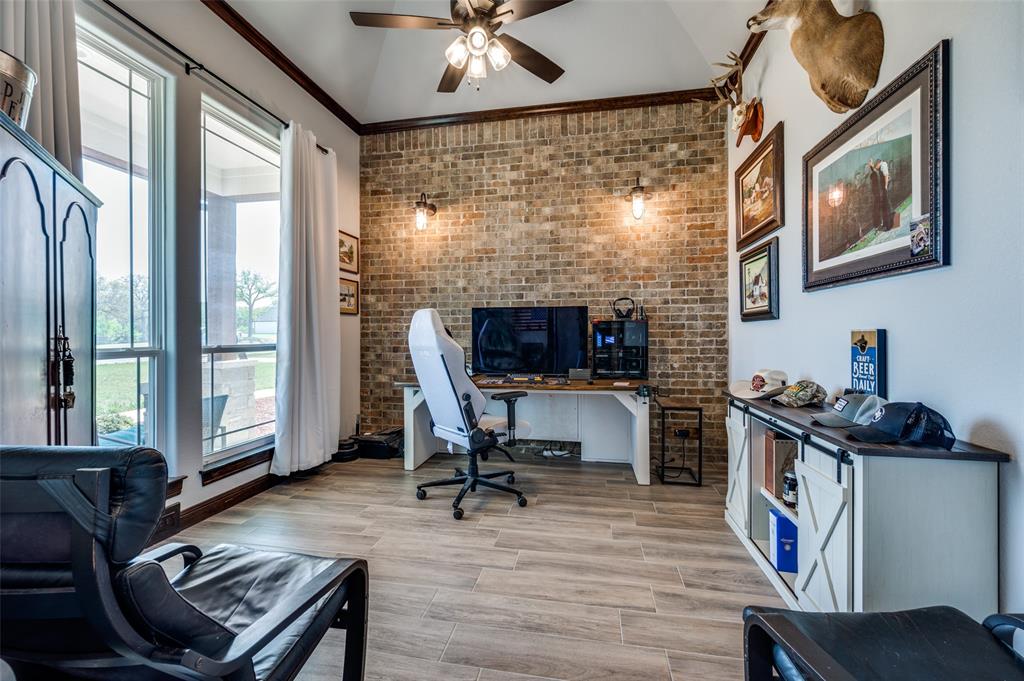 131 San Miguel Drive Decatur, TX 76234 - Photo 4 of 40 a workspace with furniture and a fireplace