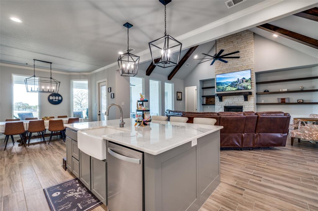 131 San Miguel Drive Decatur, TX 76234 - Photo 10 of 40 a large kitchen with a counter space a sink appliances and living room