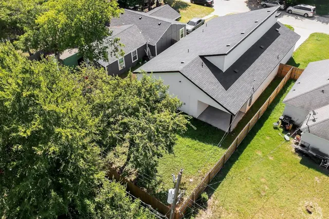 an aerial view of a house with swimming pool