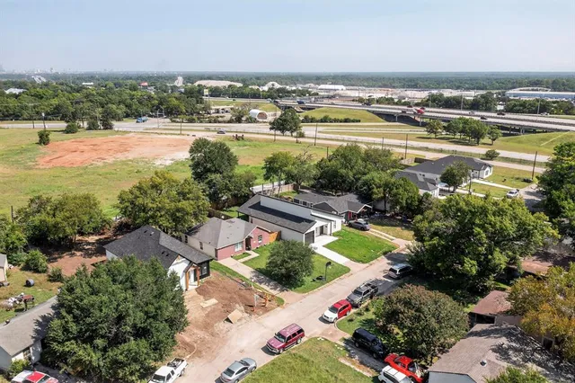 an aerial view of residential houses with outdoor space