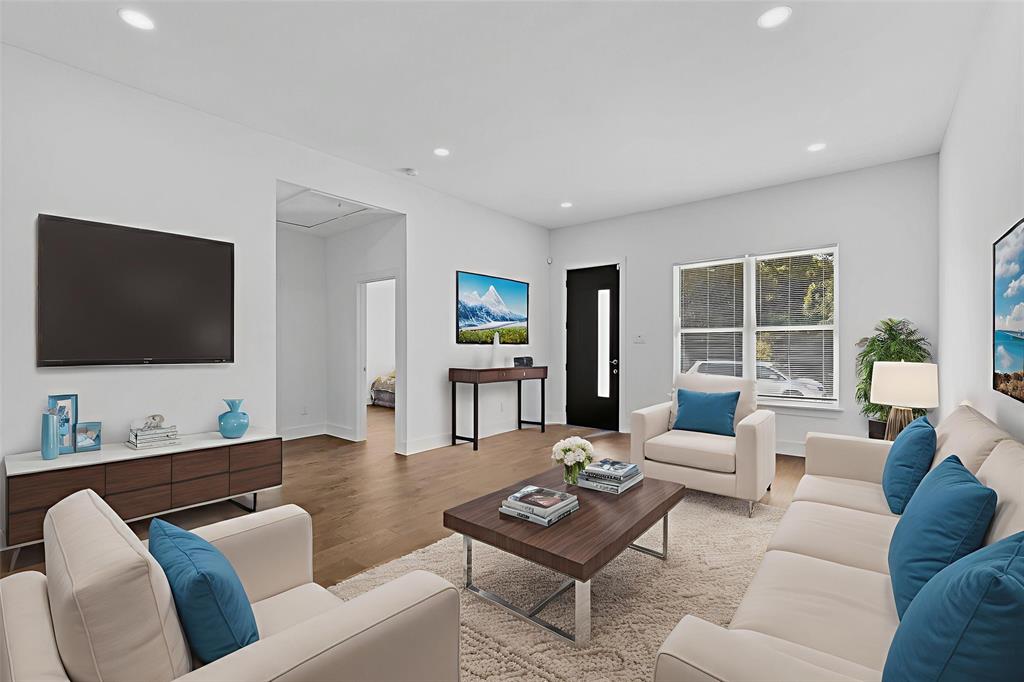 3901 Le May Avenue Dallas, TX 75216 - Photo 2 of 14 a living room with furniture and a flat screen tv
