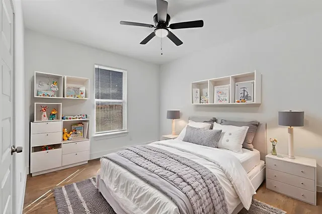 a bedroom with a bed and a book shelf
