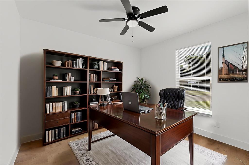 3901 Le May Avenue Dallas, TX 75216 - Photo 8 of 14 a living room with furniture and a book shelf