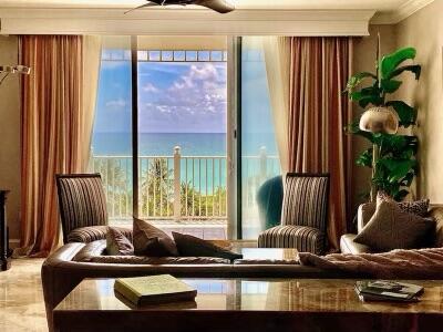 a table with a large window and chairs