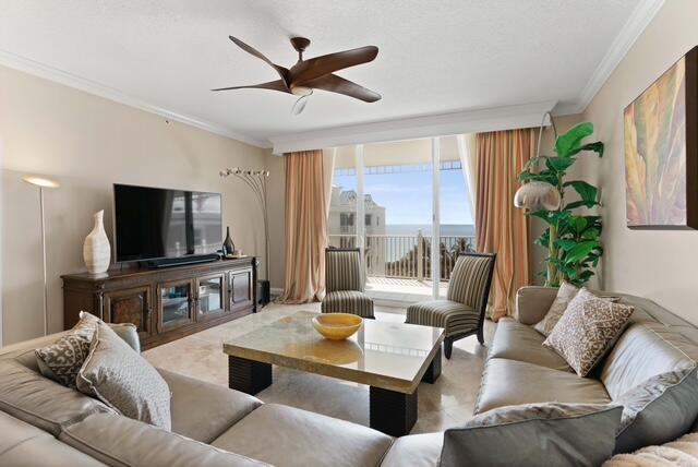 230 Ocean Grande Boulevard, Unit 802 Jupiter, FL 33477 - Photo 12 of 42 a living room with furniture and a flat screen tv