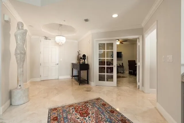 a dining hall with stainless steel appliances lots of white furniture a dining table and chairs