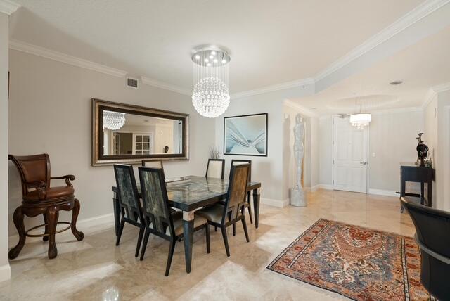 230 Ocean Grande Boulevard, Unit 802 Jupiter, FL 33477 - Photo 16 of 42 a view of a dining room with furniture