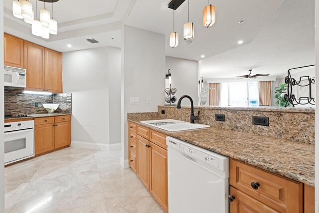 230 Ocean Grande Boulevard, Unit 802 Jupiter, FL 33477 - Photo 22 of 42 a kitchen with stainless steel appliances granite countertop a sink stove and refrigerator