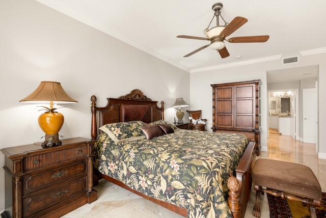230 Ocean Grande Boulevard, Unit 802 Jupiter, FL 33477 - Photo 26 of 42 a bedroom with double bed and a chandelier