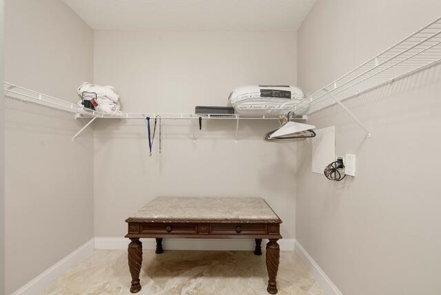 230 Ocean Grande Boulevard, Unit 802 Jupiter, FL 33477 - Photo 27 of 42 a room with a table and chairs