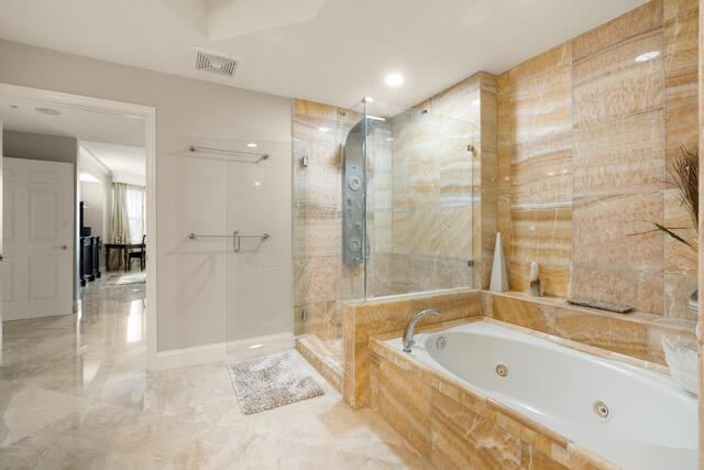 230 Ocean Grande Boulevard, Unit 802 Jupiter, FL 33477 - Photo 29 of 42 a bathroom with a large tub a shower and view