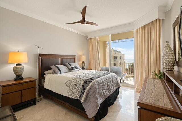 230 Ocean Grande Boulevard, Unit 802 Jupiter, FL 33477 - Photo 31 of 42 a bedroom with a bed and wooden floor