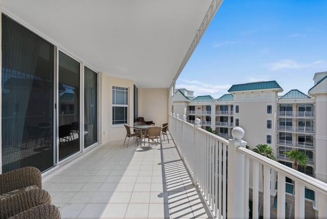 230 Ocean Grande Boulevard, Unit 802 Jupiter, FL 33477 - Photo 40 of 42 a balcony with furniture and a potted plant
