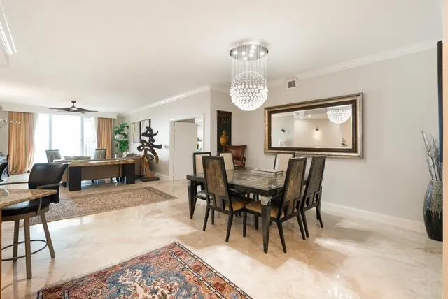 a living room with furniture a rug and kitchen view