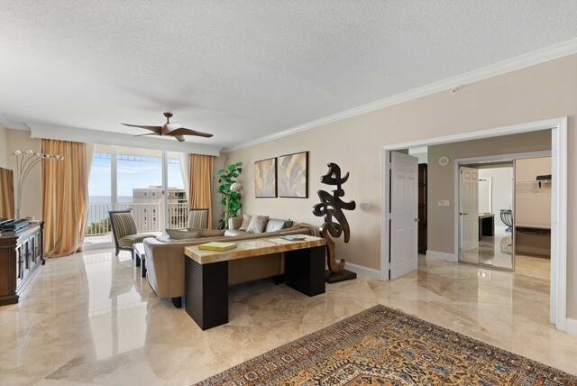 230 Ocean Grande Boulevard, Unit 802 Jupiter, FL 33477 - Photo 10 of 42 a living room with furniture a rug and kitchen view