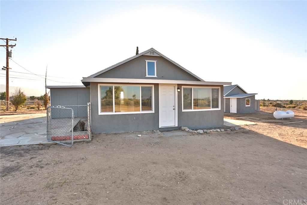 6413 Ocotillo Road Phelan, CA 92371 - Photo 1 of 1 a view of a house with a yard