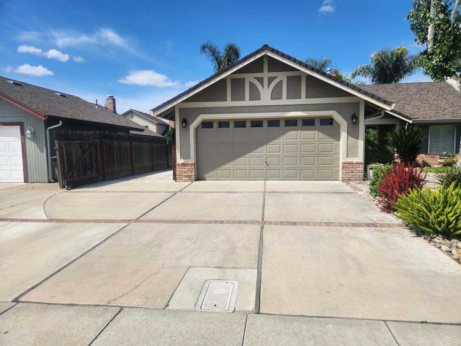 777 Jordanolo Drive Ripon, CA 95366 - Photo 3 of 61 a front view of a house with a garage