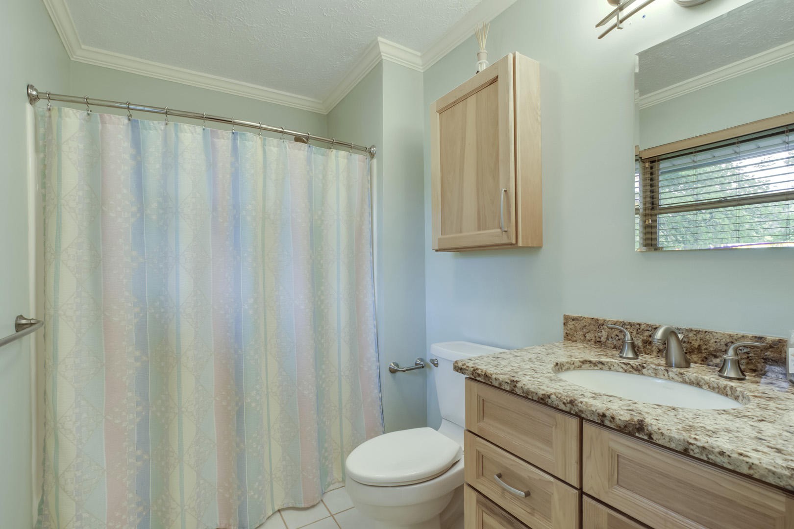 517 Gibbs Ferry Road Clinton, TN 37716 - Photo 16 of 36 a bathroom with a granite countertop sink and a mirror