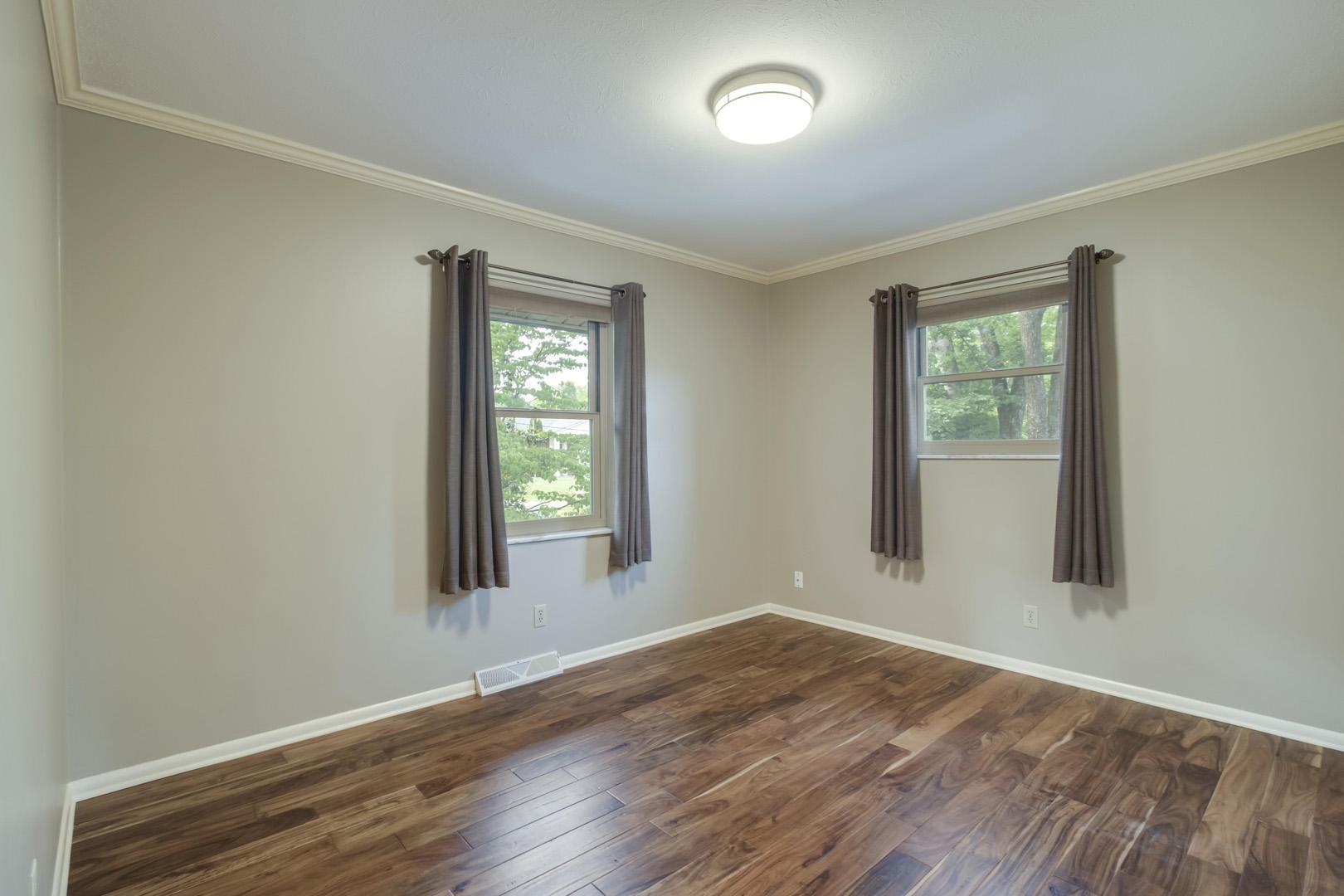 517 Gibbs Ferry Road Clinton, TN 37716 - Photo 17 of 36 an empty room with wooden floor and windows