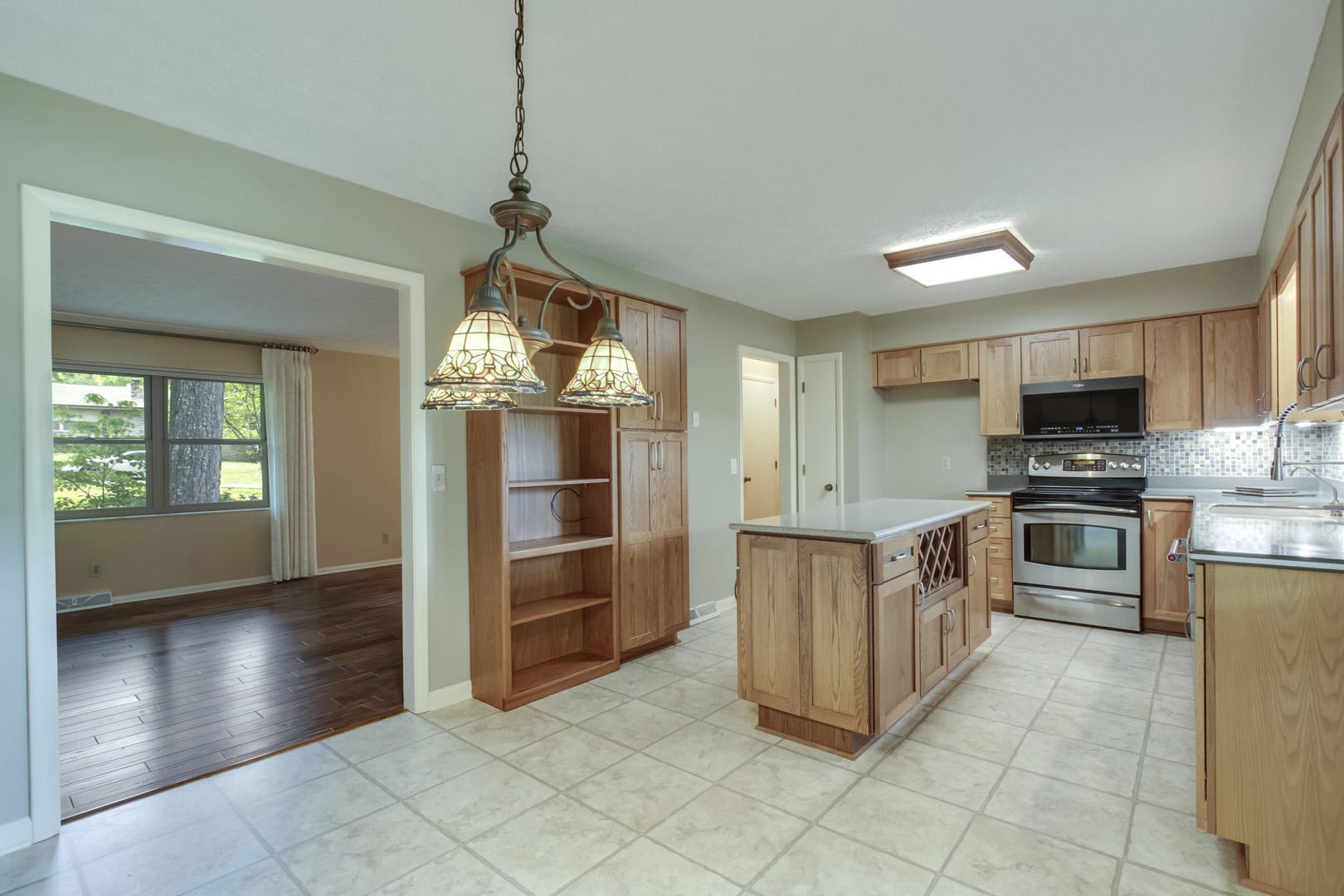 517 Gibbs Ferry Road Clinton, TN 37716 - Photo 7 of 36 a kitchen with stainless steel appliances granite countertop a stove a sink and a refrigerator
