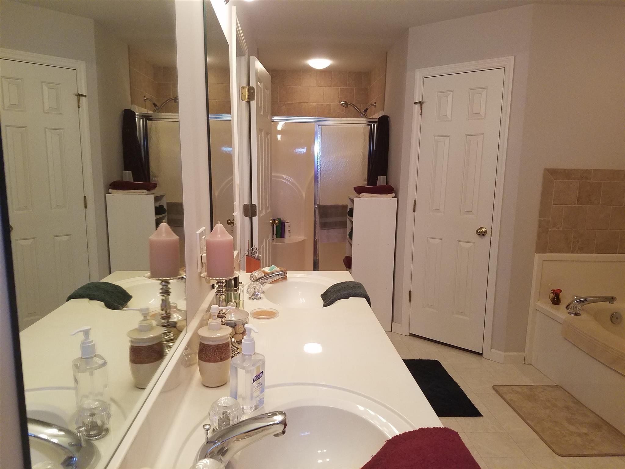 346 Petty Road Manchester, TN 37355 - Photo 13 of 30 A Nice Size Shower with Seat, His & Hers Sinks, His & Hers Closets, and a Whirlpool Tub complete the Owners' Package.