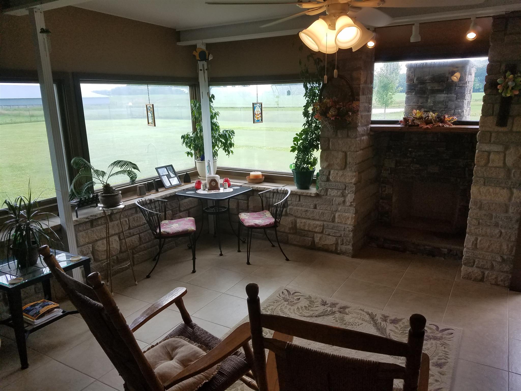 346 Petty Road Manchester, TN 37355 - Photo 18 of 30 With Windows Overlooking the Neighbor's Farm. This Room is Warm with a Fireplace that You Can Make Either Wood Burning or Gas Logs. Surrounded by Stone and Brick, Drink Your Coffee, Watch the Game, or Read Your Favorite Novel.
